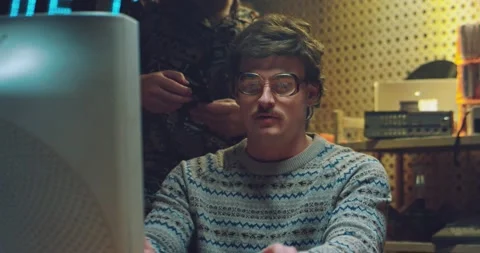 Retro males hackers talking in small room and working on vintage computer Stock Footage 135348900