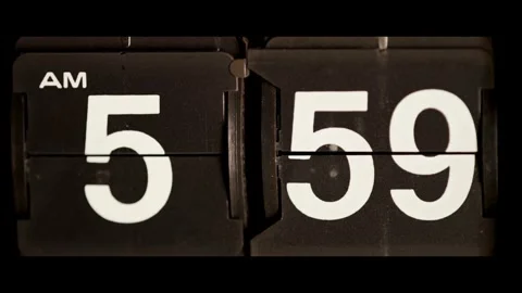 Retro mechanical flip clock changes from five fifty nine Stock Footage 329673858