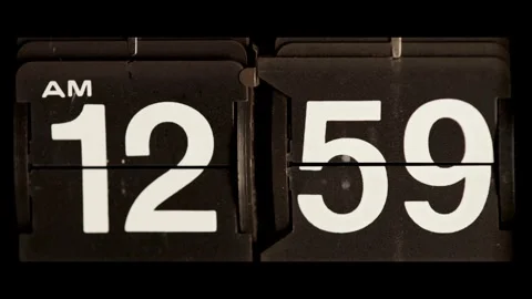 Retro mechanical flip clock changes time to one am Stock Footage 329673895