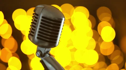 Retro microphone against colourful background Stock Footage 61477041