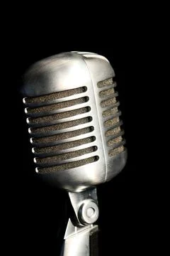 Retro microphone on a black background. Close-up image. Stock Photos