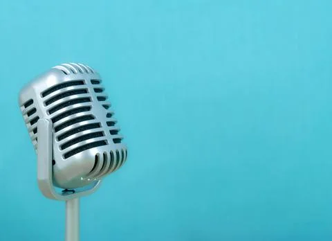Retro microphone on blue background Stock Photos