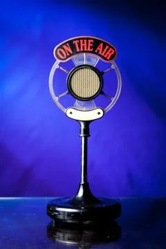 Retro microphone on a dark blue background Stock Photos