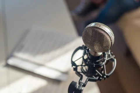 Retro microphone placed on musical notes Stock Photos