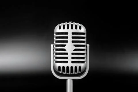 Retro microphone of silver on black background Stock Photos
