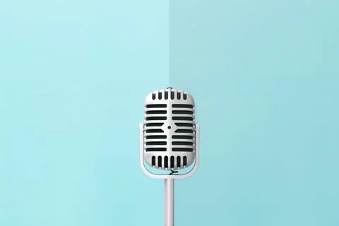 Retro microphone on soft green wall background Stock Photos