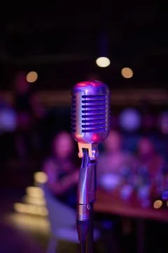 Retro microphone on stage in a pub or American Bar restaurant during a night 스톡 사진