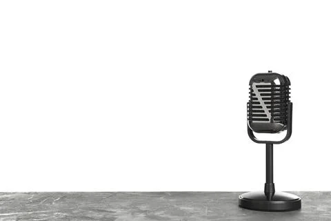 Retro microphone on table against white background. Space for text Stockfoto's