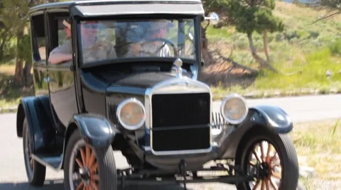 Retro: A Mint Condition Vintage Model T Backs out and Drives off. Stock Footage 41620984