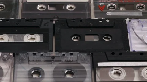 Retro music compact cassettes in rows on a table Stock Footage 88914597