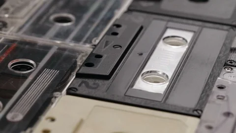 Retro music compact cassettes on a table, shallow depth Stock Footage 88672127