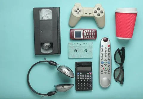 Retro objects on blue background. 3d glasses, audio cassette, video cassette, Stock Photos