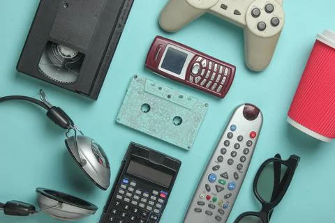 Retro objects on blue background. 3d glasses, audio cassette, video cassette, Stock Photos