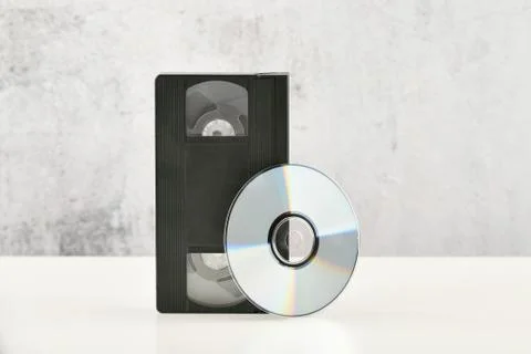 Retro objects on a white background. push-button telephone and video cassette Stock Photos