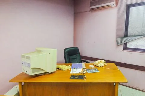 Retro Office Desk with Old Computer and Telephone Stock Photos