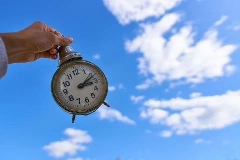 Retro old clocks on sky cloudy background concept Stock Photos
