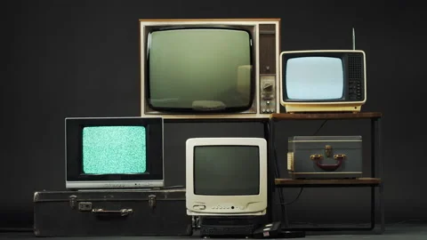 Retro old televisions on black background. Collection of ancient, old-styled Stock Footage 156615538