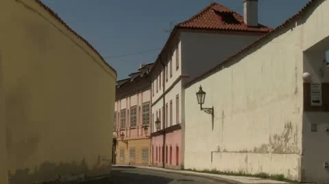 Retro oldtimer car riding down the old town street Stock Footage 21774481
