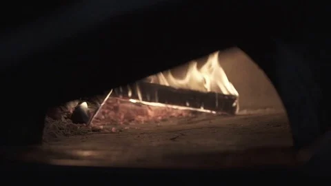 Retro oven fire in slow motion cooking pizza Stock Footage 71171463