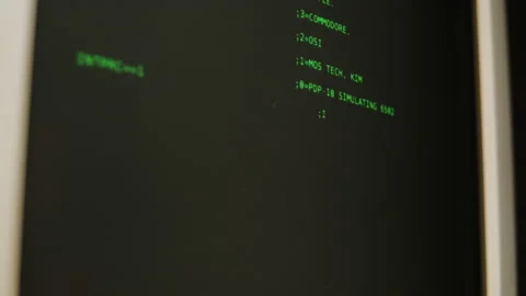 Retro pc with loading code console, programmer making scripts, green basic Stock Footage 218272360