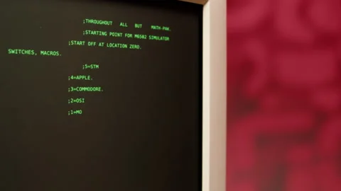 Retro pc with loading code console, programmer making scripts, green basic Stock Footage 220368820
