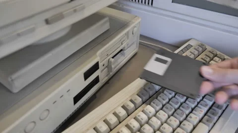 Retro PC Look. View Of Inserting An Old-style 3.5" Floppy Disk Stock Footage 157961225