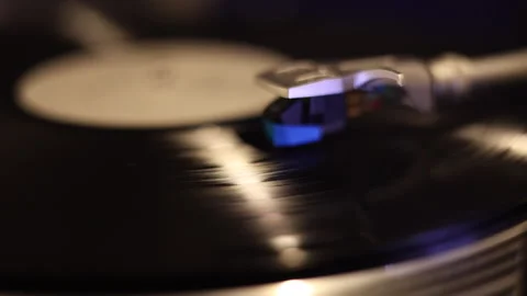 Retro plastic plays. cinematic playing a vinyl record Stock Footage 312398917