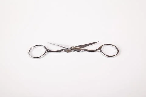 Retro professional small tailor scissors, isolated on white background Stock Photos
