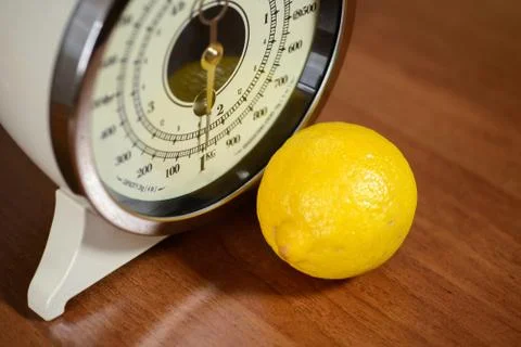 Retro scale with lemon Stock Photos