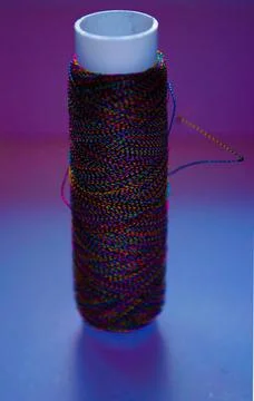 Retro sewing items: tailoring scissors, cutting knife, thimble, wooden thread Stock Photos