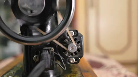 Retro sewing machine operating with shallow depth of field Stock Footage 342773730