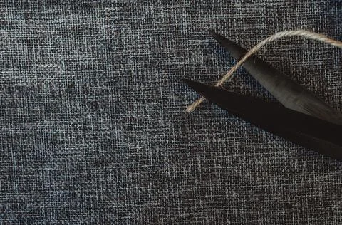 Retro sewing tools: old scissors, bobbins of thread on gray fabric. Tailor's  Stock Photos