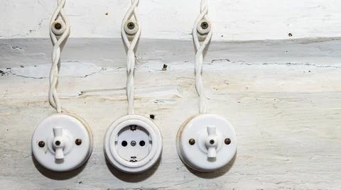Retro socket and two switchs. A vintage outlet and electrical wiring on white Stock Photos