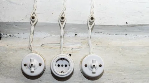 Retro socket and two switchs. A vintage outlet and electrical wiring on white Stock Photos
