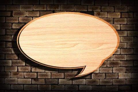 Retro speech bubbles from splat on old brick wall Stock Photos