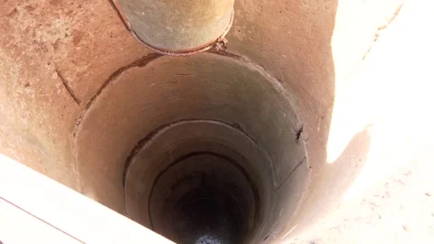 Retro stone water well in rural area. Old village Well Video stock 314963053