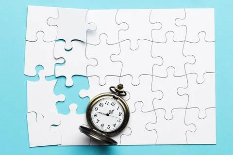Retro stopwatch incomplete white puzzle blue background 스톡 사진