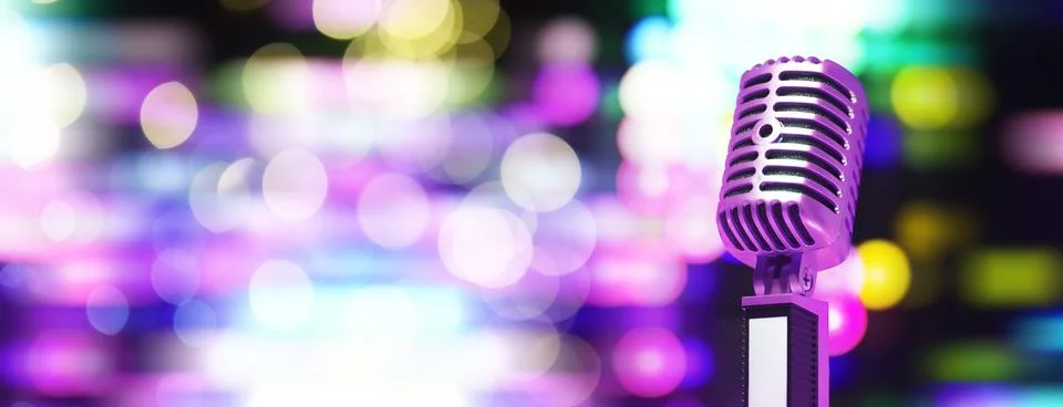 Retro style microphone on background with backlight. Vintage silver Microphon Stock Photos
