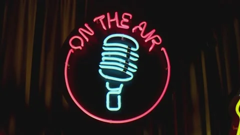 Retro style neon microphone sign hanging on the wall in club or pub . Stock Footage 167304698
