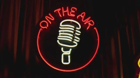 Retro style neon microphone sign hanging on the wall in club or pub . Stock Footage 167305095