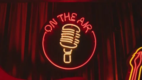Retro style neon microphone sign hanging on the wall in club or pub . Stock Footage 167357910
