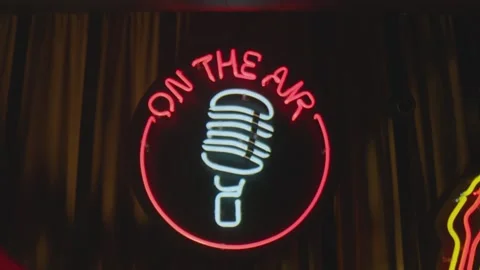 Retro style neon microphone sign hanging on the wall in club or pub . Stock Footage 167359853