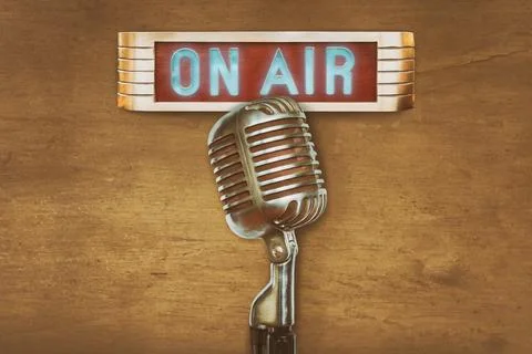 Retro styled image of an authentic vintage microphone with on air illuminat.. Stock Photos