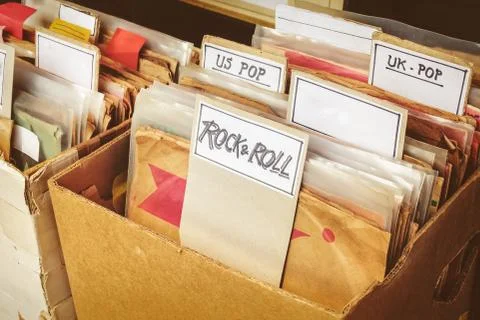 Retro styled image of boxes with vinyl turntable records Stock Photos