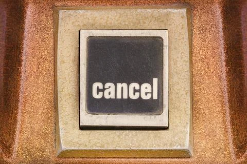 Retro styled image of a cancel button on a vintage arcade game machine Stock Photos