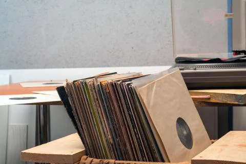 Retro styled image of a collection of old vinyl record lp's with sleeves on.. Stock Photos