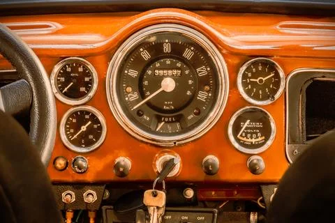 Retro styled image of a dashboard with large speedometer of a British vinta.. Stock Photos