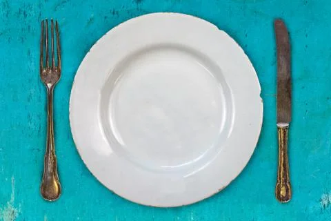 Retro styled image of an empty dinner plate Foto stock