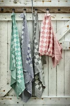 Retro styled image of hanging dish cloths Stock Photos