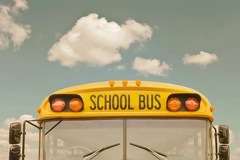 Retro styled image of an old American yellow school bus Stock Photos